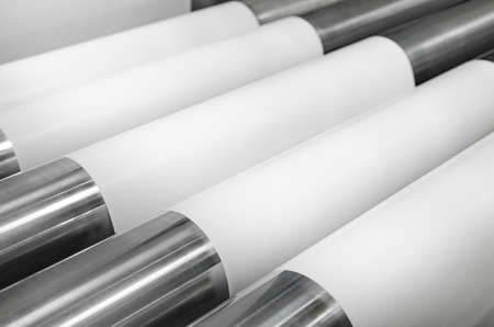 Detail of offset printing machine with roll of paper and rollersの写真素材