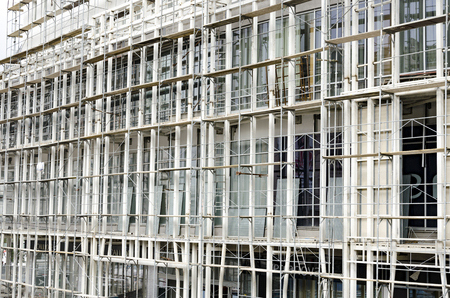 scaffolding and building facade - construction siteの写真素材