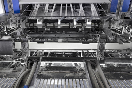 Closeup vew inside offset sheetfed printing machine, transportation unitの写真素材