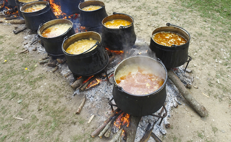 A group of cauldrons and kettle on fire at tourist camp. Army vintage cookingの写真素材