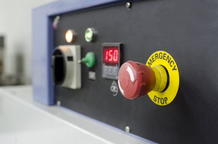 Red button with emergency stop wordの写真素材