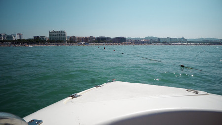 Front POV of sailing yacht through the waves at the Mediteranean seaの写真素材