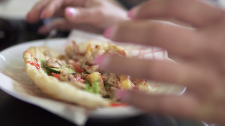 Woman eating Doner Kebab Sandwichの写真素材