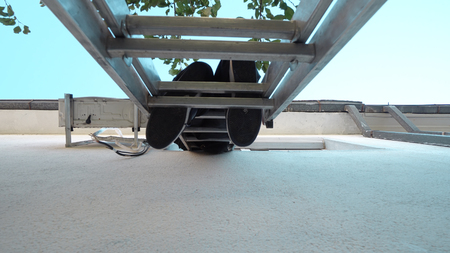 Techican man electrician installing air conditioning in a client house, cinematic steadicam shotの写真素材