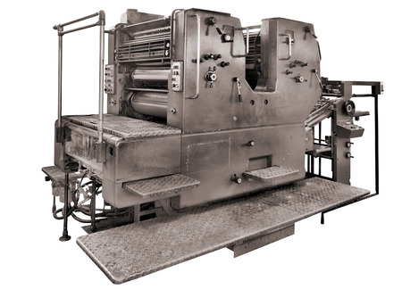 Old printing press isolated on white- rotary machine - polygraphic equipment, clipping path includedの写真素材