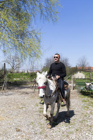 riding a horse in Western styleの写真素材