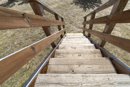 Wooden stairs with fence, POV perspectiveの写真素材