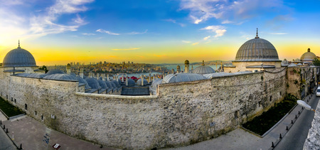 Panoramic view of Istanbul, Turkey. Istanbul through the domes and chimneys of the Suleymaniye Complex at sunsetの写真素材