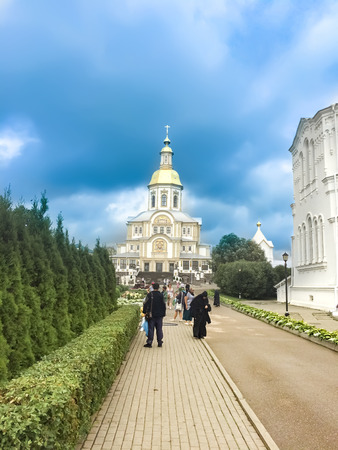 DIVEEVO, RUSSIA - circa APR, 2016: Unidentified pilgrims go to Divine Liturgy at Trinity Cathedral and Saviour Transfiguration Cathedral of Holy Trinity Seraphim-Diveevo convent in Diveevo, Russiaのeditorial素材