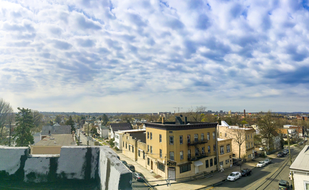A panoramic view of the New Jersey neighborhood with the New York City skyline off in the distance