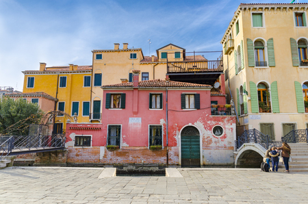 Street with colorful buildings in Venice, Italy. Architecture and landmarks of Venice, postcardのeditorial素材