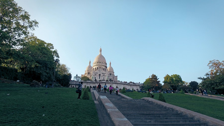 People Tourists Sit Rest On The Stairs Under Sacre Coeur Basilica In Paris Montmartre, cinematic shotのeditorial素材