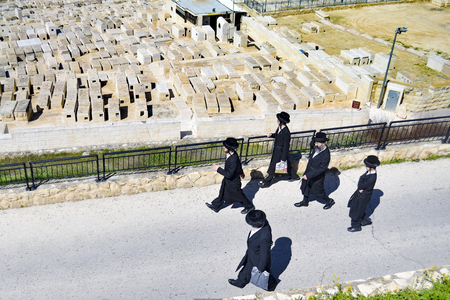 Jewish people in traditional suit at the Mount of Olives Jewish Cemeteryのeditorial素材