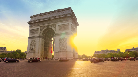 Paris, France - 5 May, 2017: Low angle view of traffic at Arc de Triomph circle at sunset. This historical monument overlooks the avenue des champs lyses in the heart of French capital. のeditorial素材