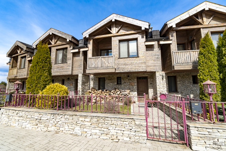 Traditional street with wooden row houses - architecture background
