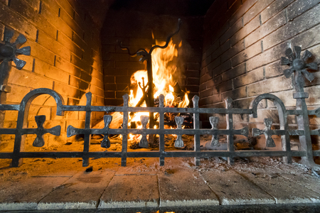 Closeup of firewood burning in fire. Fireplace in the houseの写真素材