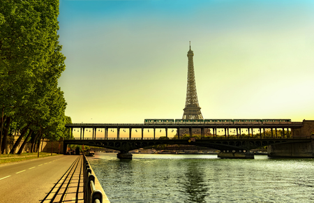 Magnificent Sunrise with the Eiffel Tower and metro train on Bir Hakeim bridgeの写真素材