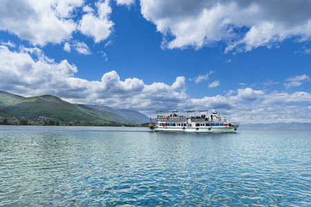 Boat on Ohrid lake in a beautiful summer cloudy day