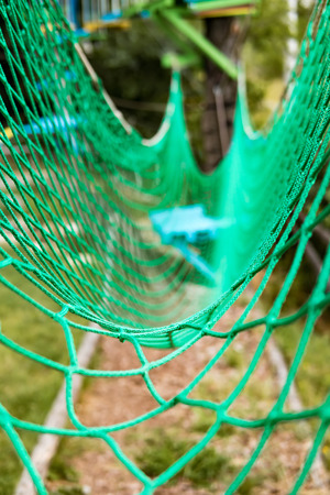 Rope Park Bridge Net Overcoming obstacles and reaching heights abstract conceptの写真素材
