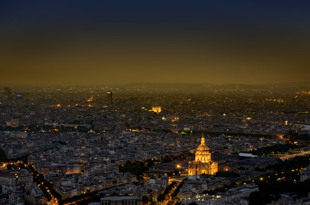 Aerial view of Paris city of light with veiw of  Domes Les Invalides and Arc de Triumph, at sunset...