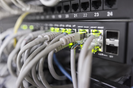 Fast ethernet gigabit switch front view, dof copyspace backgroundの写真素材