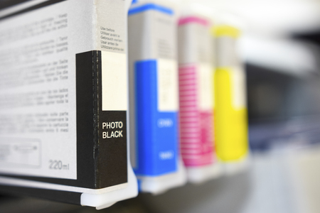 Large printer format inkjet cartriges detail black, cyan, magenta, yellow colorの写真素材