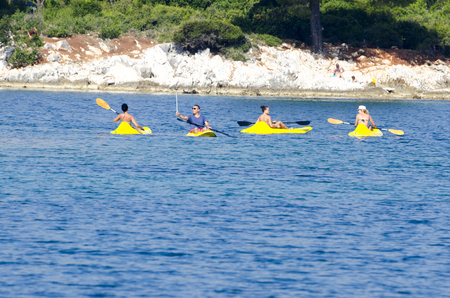 Group of people kayaking on sea. Summer vacation recreationの写真素材