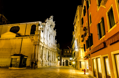 Night scene of street with Church Santa Maria del Giglio facade in Venice, Italyの写真素材