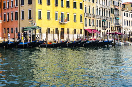 Venice gondola parking spot at Grand Canal, Italyの写真素材