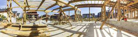 Panorama of new framed construction of a house building from the ground up