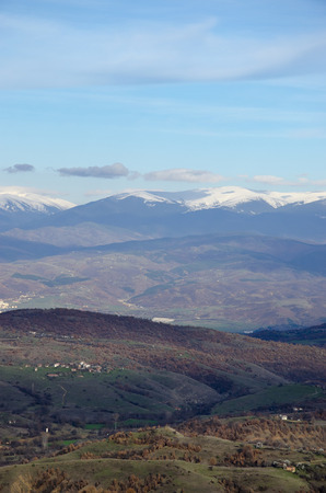 Early morning in scenic Bulgarian rocky mountains with snow and valley hillsの写真素材