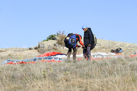 Paraglider tandem preparation for taking offの写真素材