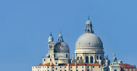 Panoramic view of top of Old cathedral of Santa Maria della Salute in Venice, Italyの写真素材