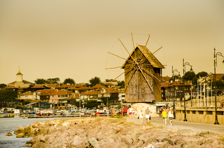NESEBAR, BULGARIA - circa JULY, 2017: Old town of Nessebar with wooden windmill is popular tourist attraction in Bulgariaのeditorial素材