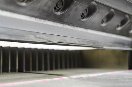 Industrial knife cutter. Paper guillotine used in commercial offset printing industryの写真素材