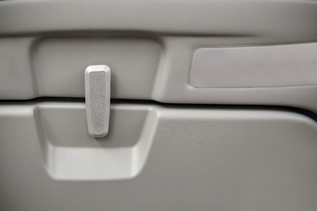 Airplane Tray Table, close-up of latch and trayの写真素材