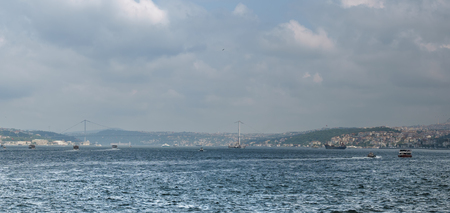 Panoramic view of cruise ships on the Bosphorus Strait at Istanbul Turkey and cloudsの写真素材