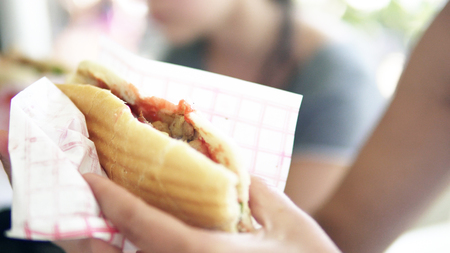 Woman eating Doner Kebab Sandwich, unhelathy fast foodの写真素材