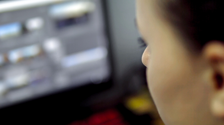 Over The Shoulder Footage of Stylish brunette working from home in her home office, cinematic dofの写真素材
