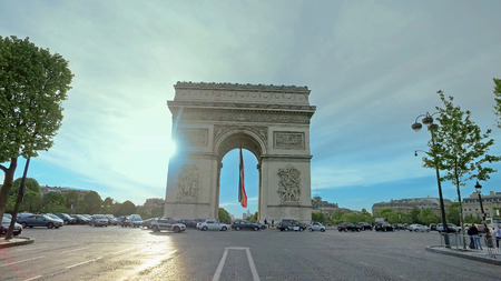 Paris, France - circa May, 2017: Traffic around the famous Arc du triomphe. Police block the way fro security reason, hyperlapse cinematic viewのeditorial素材