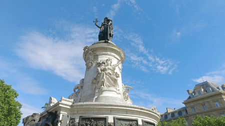 Bronze statue of Marianne in the center of the Place de la Republique square in Paris, France. Marianne holds an olive branch in her right hand. Hyperlapse shotのeditorial素材