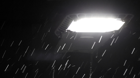 Drops of rain at night under street led light. Abstract backgroundの写真素材
