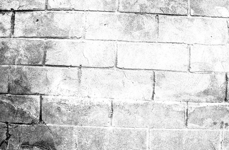 Fragment of old dirty brick wall with peeling plaster texture white grey brown black green blue lime yellow orange maroon violet pink turquoise, stone surface with cracks, useful as background tonedの写真素材