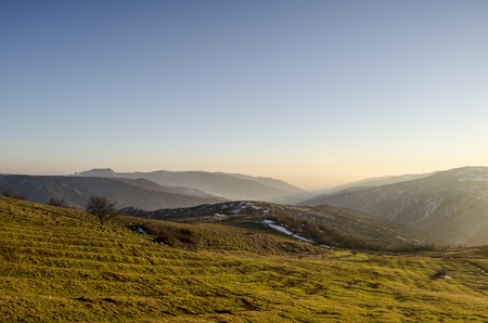 Beautiful landscape in the mountains with the sun at dawn. Mountains at the sunset time. Azerbaijan,...