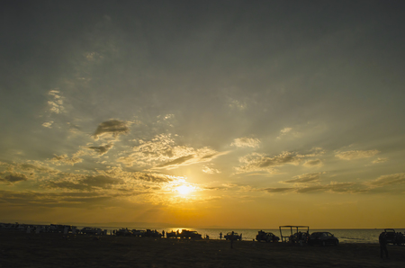 Beautiful blazing sunset landscape at Caspian sea and orange sky above it with awesome sun golden reflection on calm waves as a background. Amazing sunset view on the beach. Azerbaijan Absheron, Bakuの写真素材