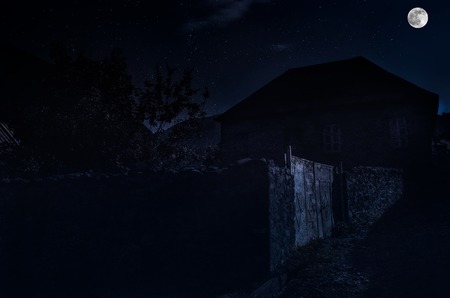 Beautiful landscape of Ilisu mountain village on the hillside. Big Caucasus mountains at night in full moon light. Azerbaijan natureの写真素材