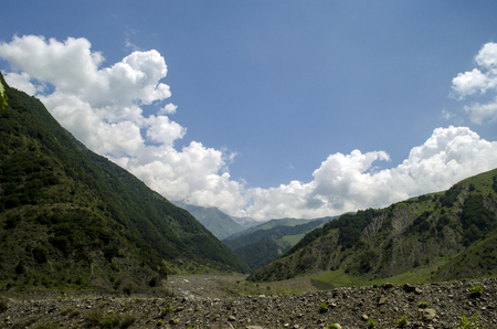 Beautiful summer landscape in mountains, green meadows and the dark blue sky with clouds . Big Caucasus. Azerbaijan. Gakh. Ilisuの写真素材