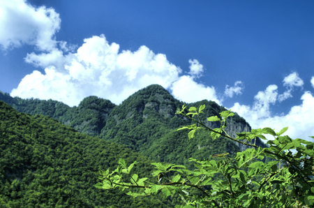 Beautiful summer landscape in mountains, green meadows and the dark blue sky with clouds . Big Caucasus. Azerbaijan. Gakh. Ilisuの写真素材