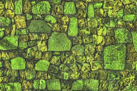 Fragment of old brick wall with river stones texture white grey brown black green blue lime yellow orange maroon violet pink turquoise colored background, different type of stones mosaic surfaceの写真素材