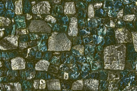 Fragment of old brick wall with river stones texture white grey brown black green blue lime yellow orange maroon violet pink turquoise colored background, different type of stones mosaic surfaceの写真素材